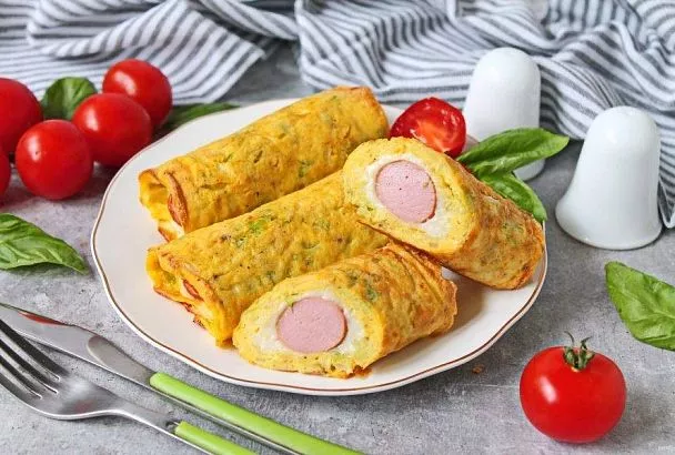 Чудо-трубочки с сосисками на завтрак без теста. Основу составляют яйца и капуста, и дети всегда съедают их первыми